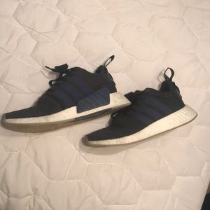 Black NMD’s with blue stripes